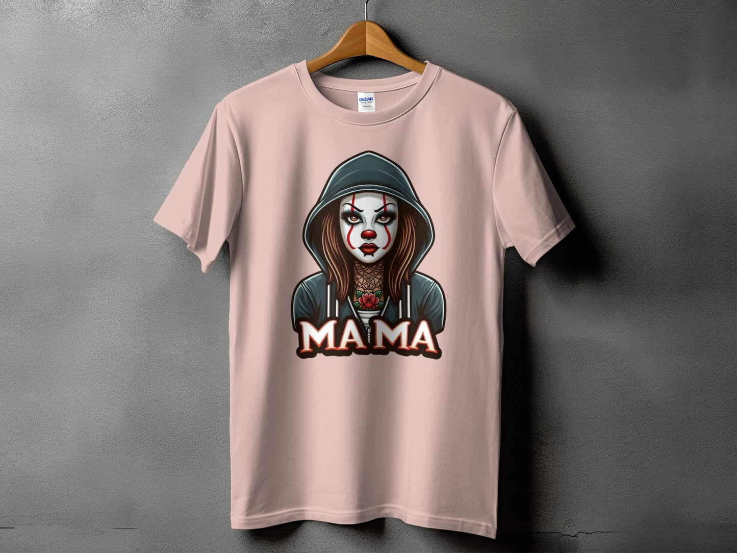 Pink t-shirt with a hooded figure with clown makeup and "MAMA" text.