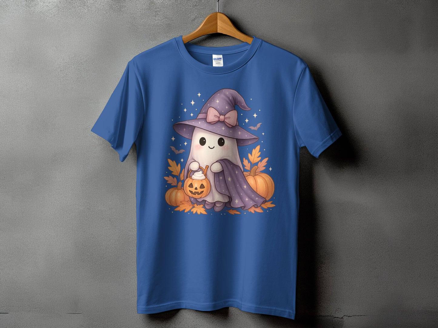 Blue t-shirt with a cute ghost wearing a witch hat holding a pumpkin bucket.