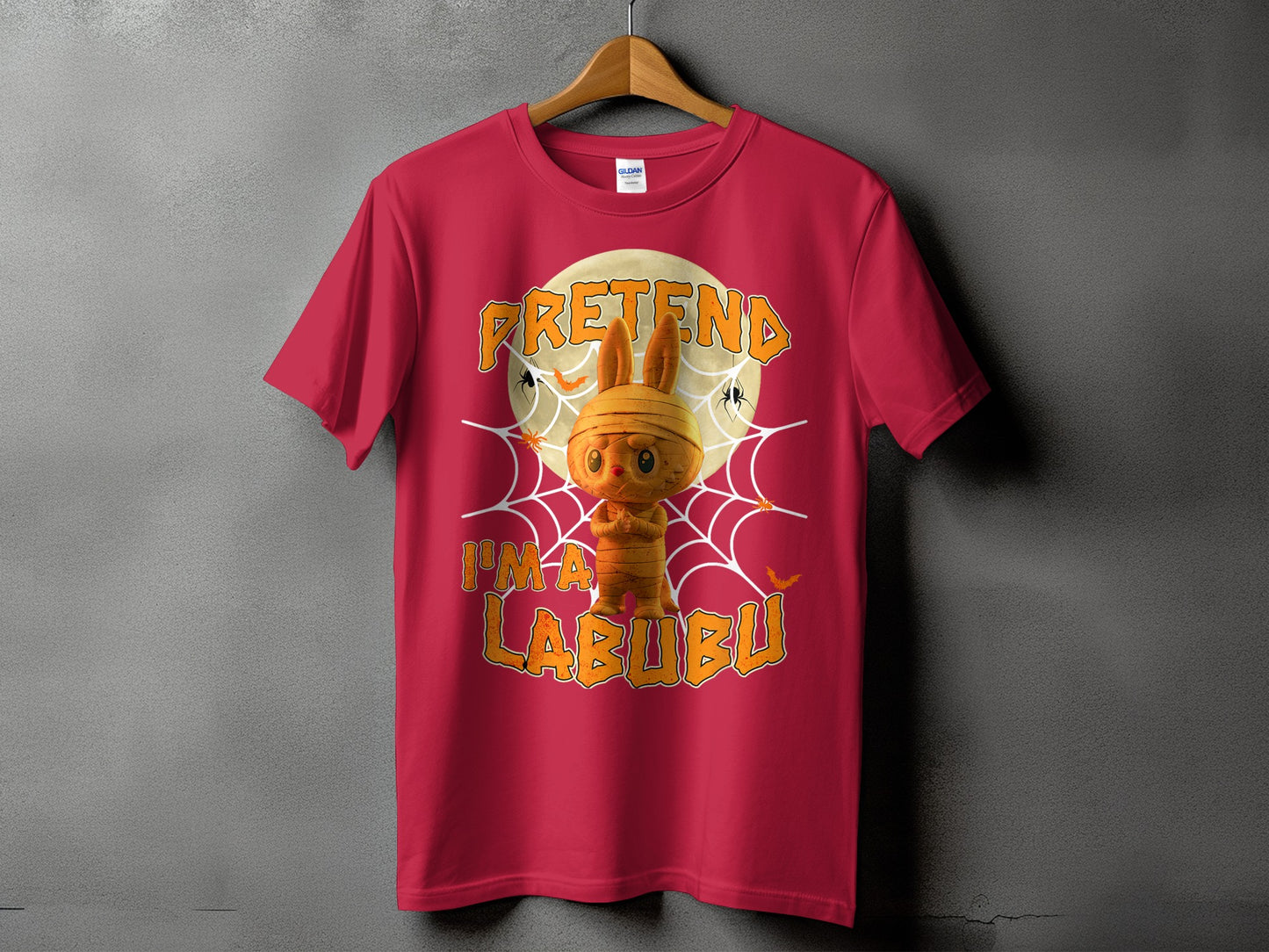 Red t-shirt with "Pretend I'm a Labubu" Halloween graphic.