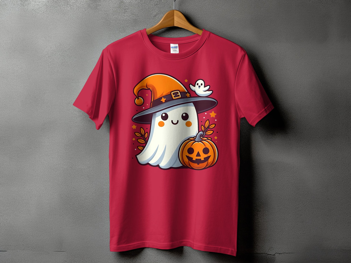 Red t-shirt with a cartoon ghost in a witch hat and pumpkin.