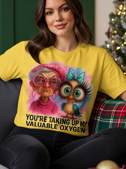 Yellow t-shirt with a cartoon owl and grumpy woman saying "You're taking up my valuable oxygen."