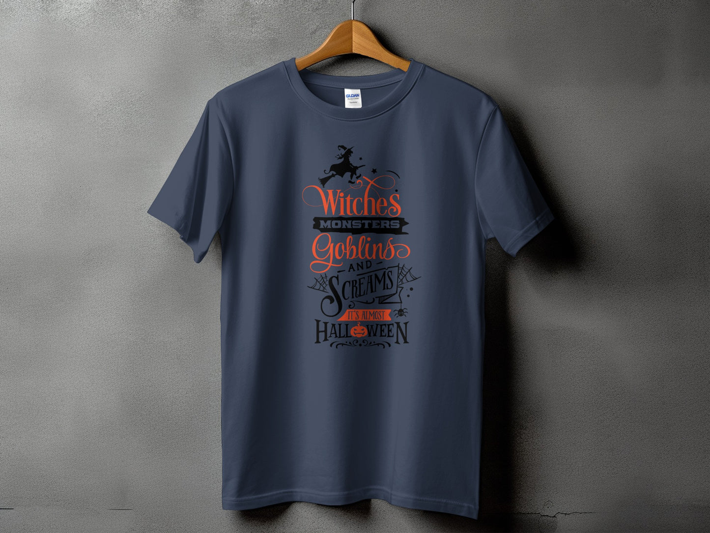 Dark blue t-shirt with "Witches, Monsters, Goblins and Screams It's Almost Halloween" graphic.