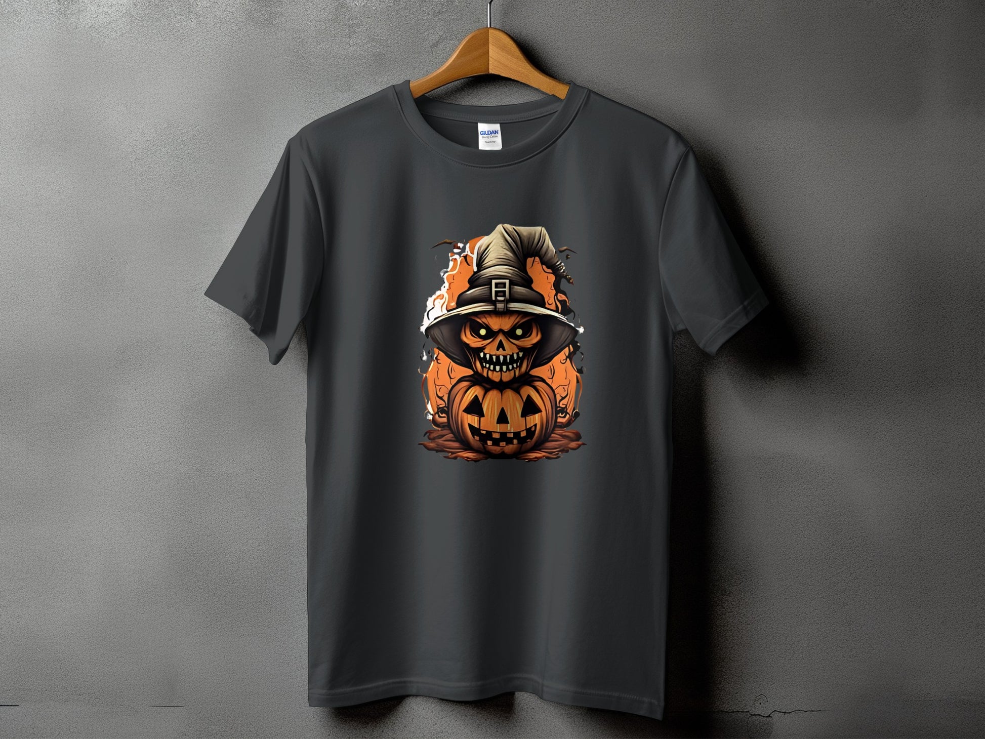 Dark gray t-shirt featuring a Halloween pumpkin character wearing a witch hat.