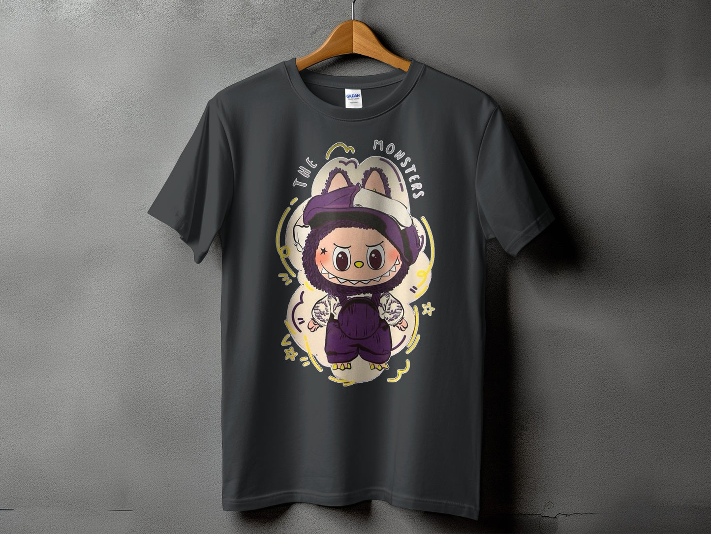Dark grey t-shirt with cartoon monster design and text "THE MONSTERS".