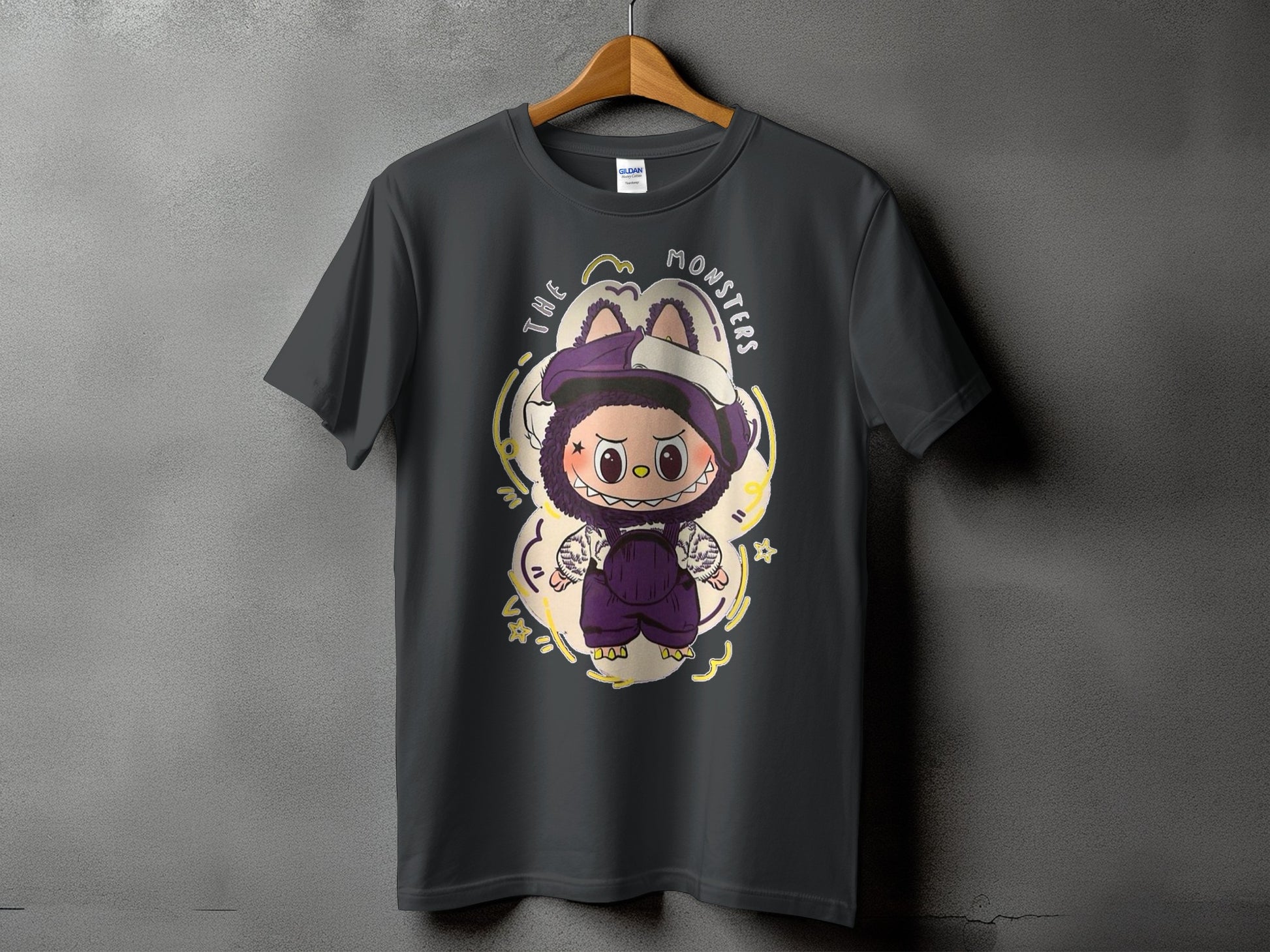 Dark grey t-shirt with cartoon monster design and text "THE MONSTERS".