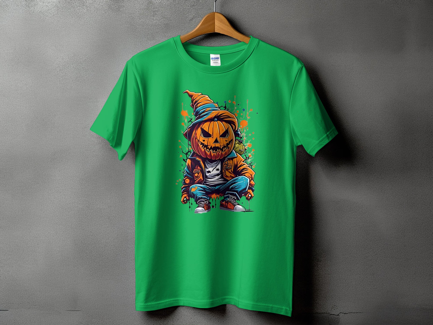 Green t-shirt with a cartoon pumpkin character wearing a hat and jacket.