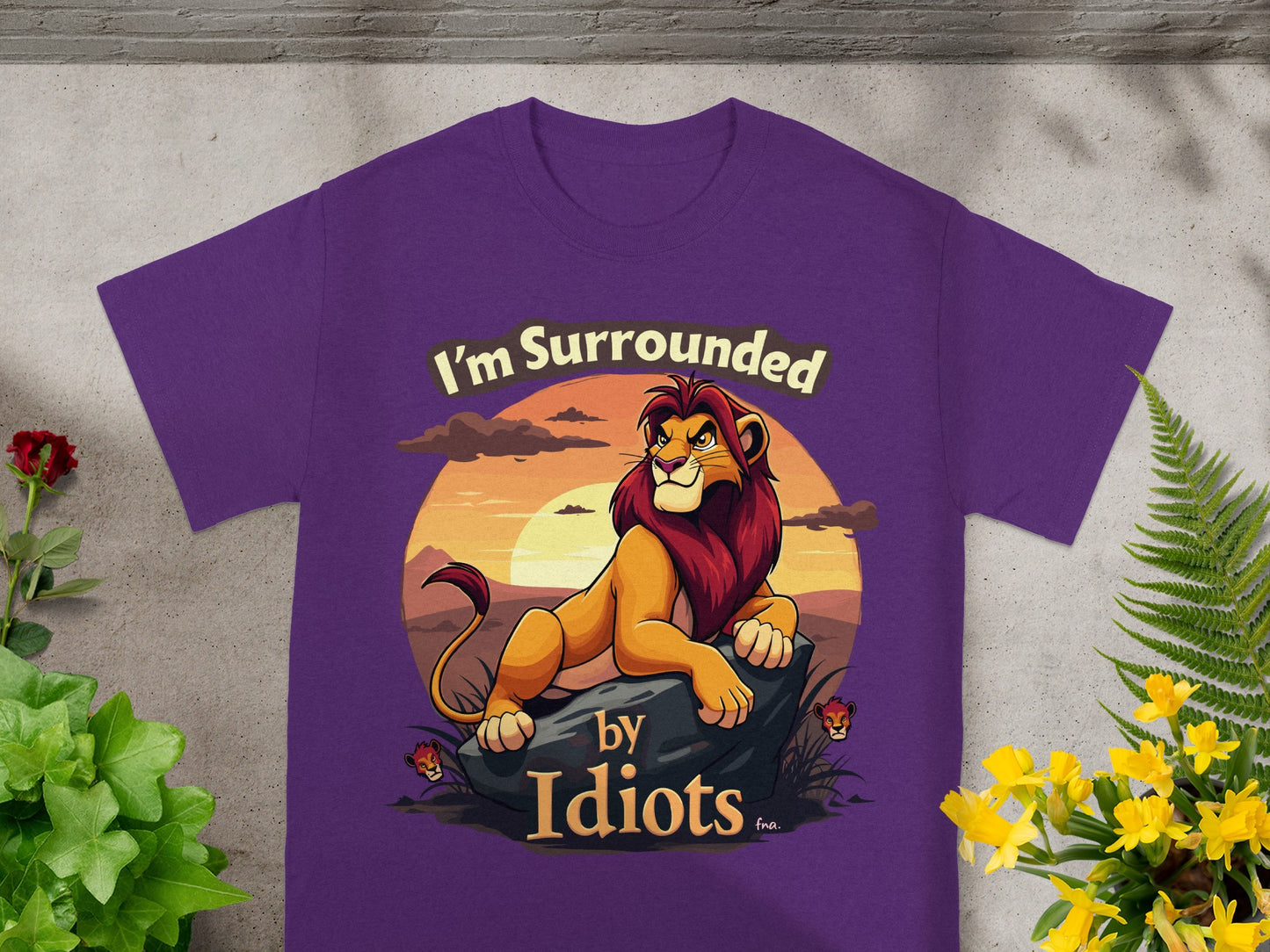 Purple t-shirt with a lion and the text "I'm Surrounded by Idiots."