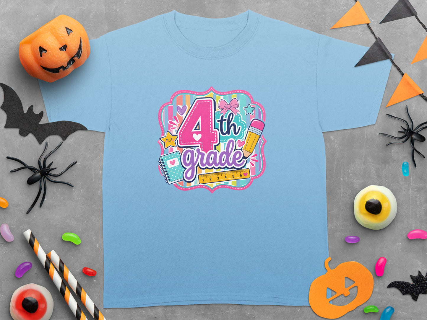 Light blue t-shirt with "4th grade" design and Halloween decorations.