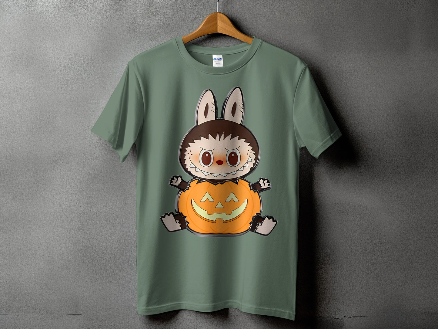 Green t-shirt with a cartoon character in a pumpkin costume.