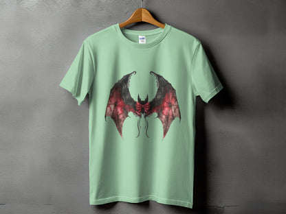 Light green t-shirt with a black and red bat wings graphic with a bow.