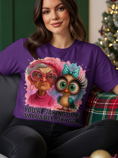 Illustration of a grumpy elderly woman and an owl on a purple t-shirt.