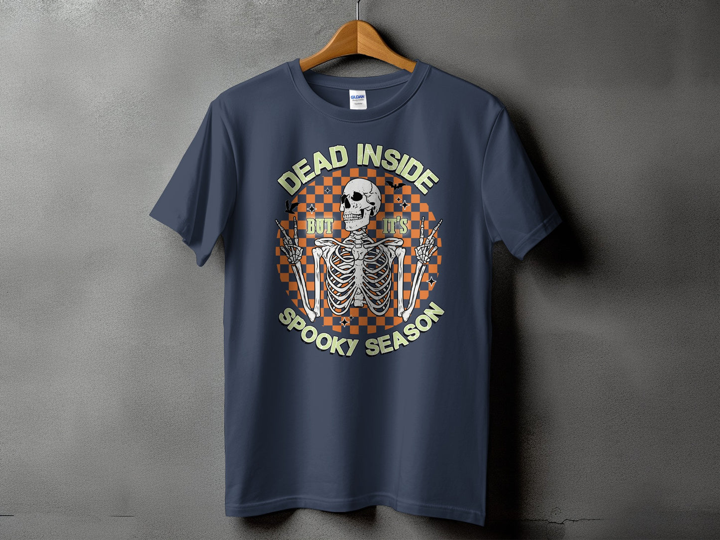 Dark blue t-shirt with skeleton graphic saying "Dead Inside But It's Spooky Season."