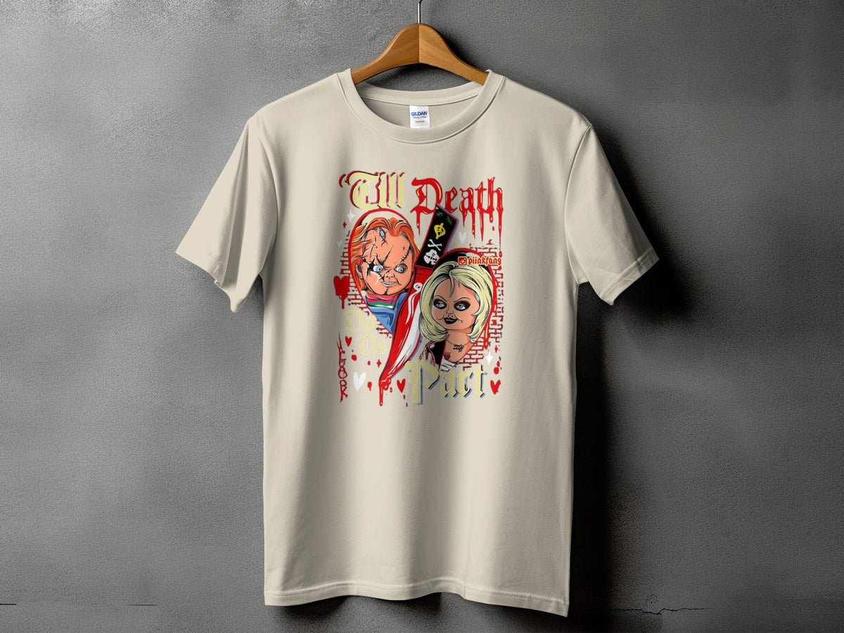 Chucky and Tiffany dolls on a beige t-shirt with "Till Death Do Us Part" text.