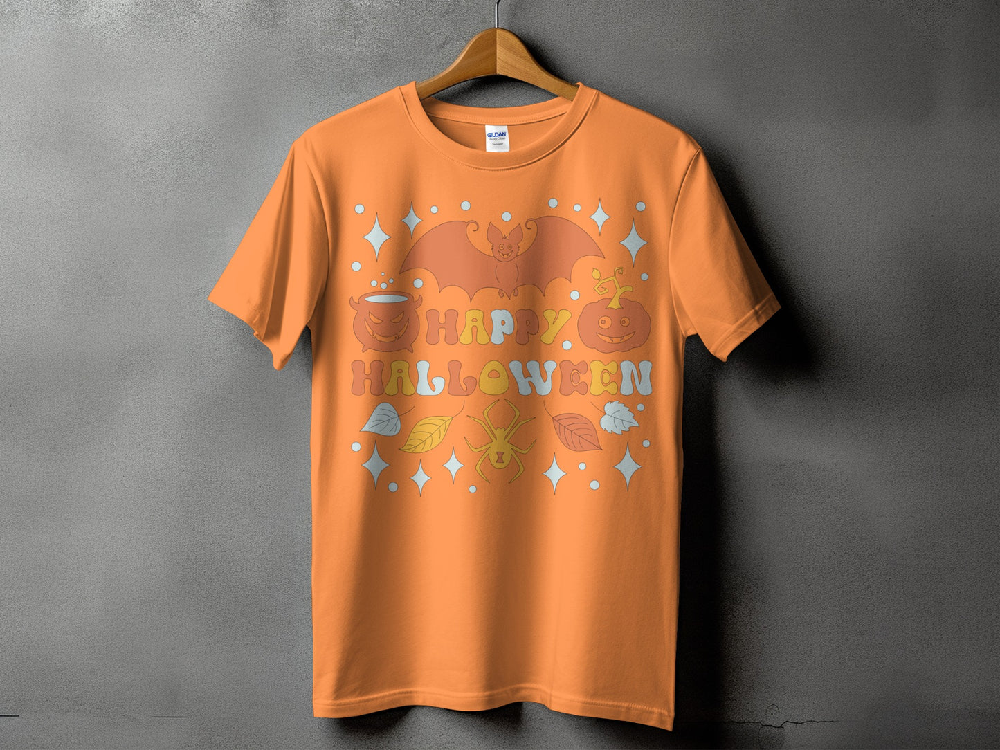Orange t-shirt with "Happy Halloween" text, bat, pumpkin, spider, and leaves graphic.