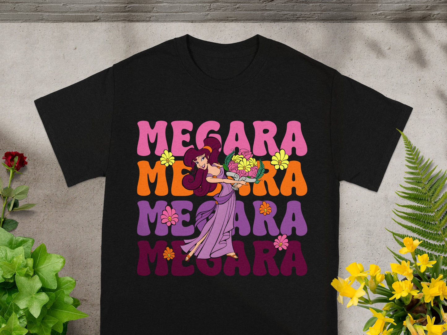 Black t-shirt with Megara's name in colorful lettering and a character illustration.