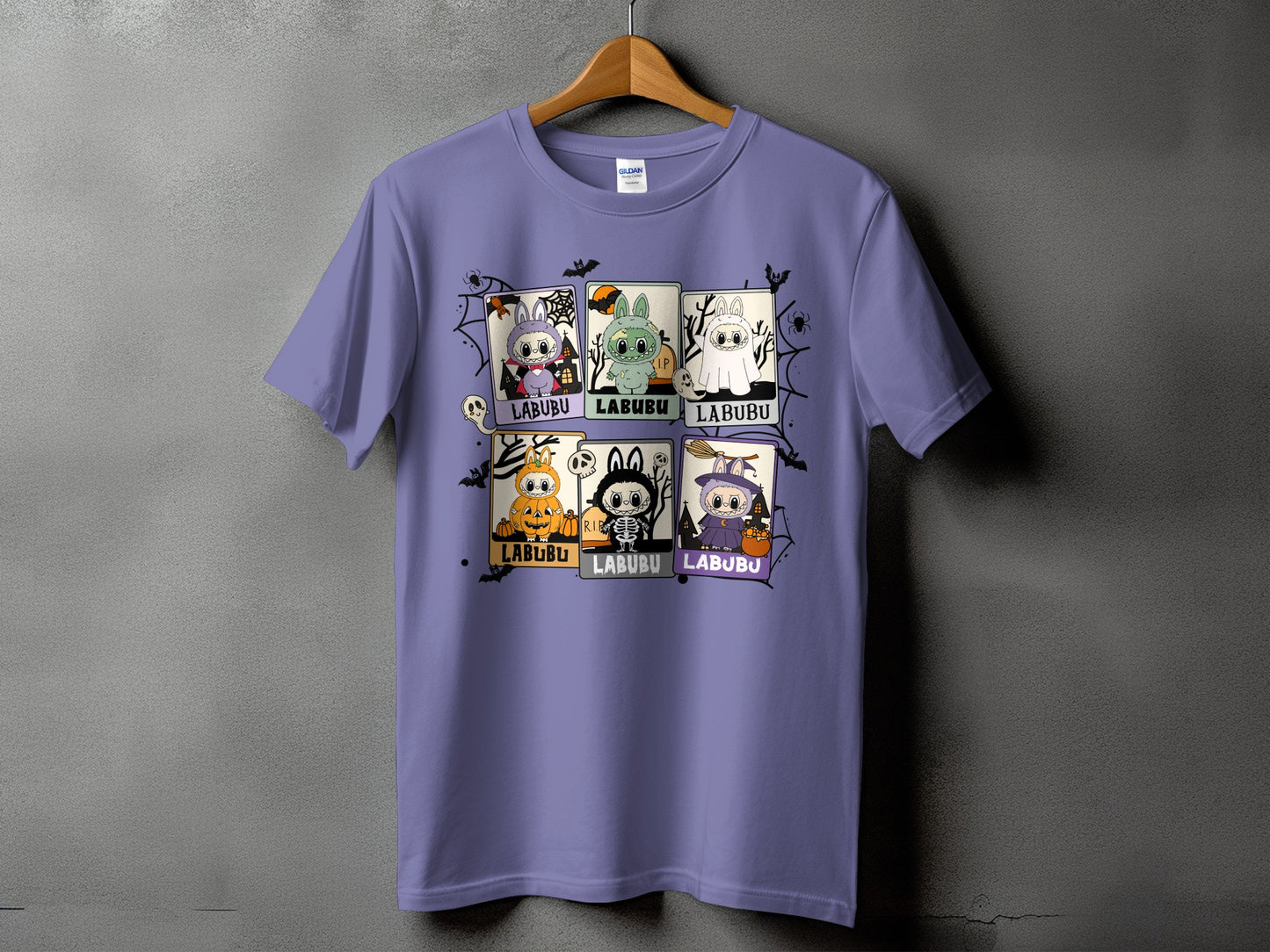 Purple t-shirt with six framed Halloween-themed Labubu characters and spooky graphics.