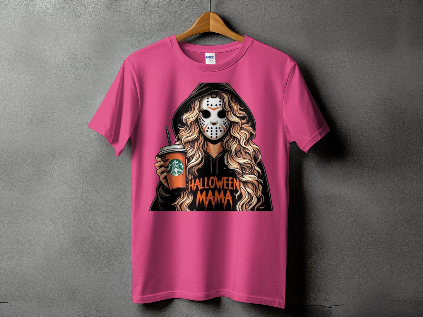 Pink t-shirt with a graphic of a woman in a hockey mask holding a coffee cup and text "Halloween Mama".