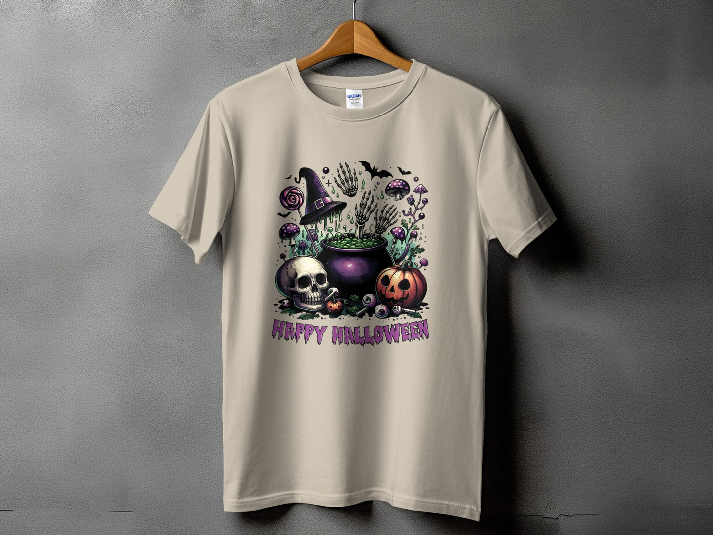 T-shirt with Halloween graphic featuring cauldron, skull, pumpkin, and text "HAPPY HALLOWEEN".