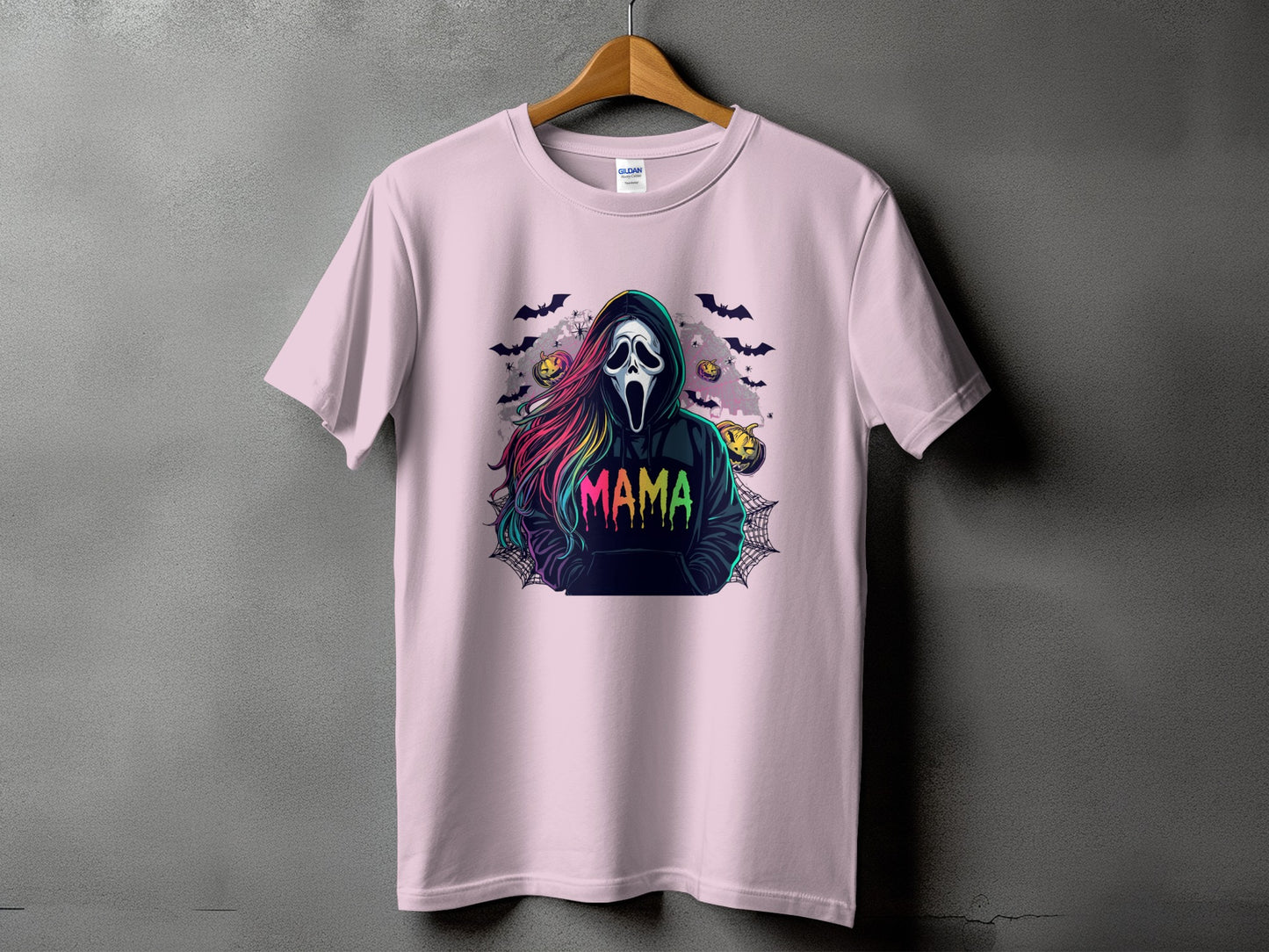Pink t-shirt with a ghost mask, rainbow hair, and "MAMA" text.