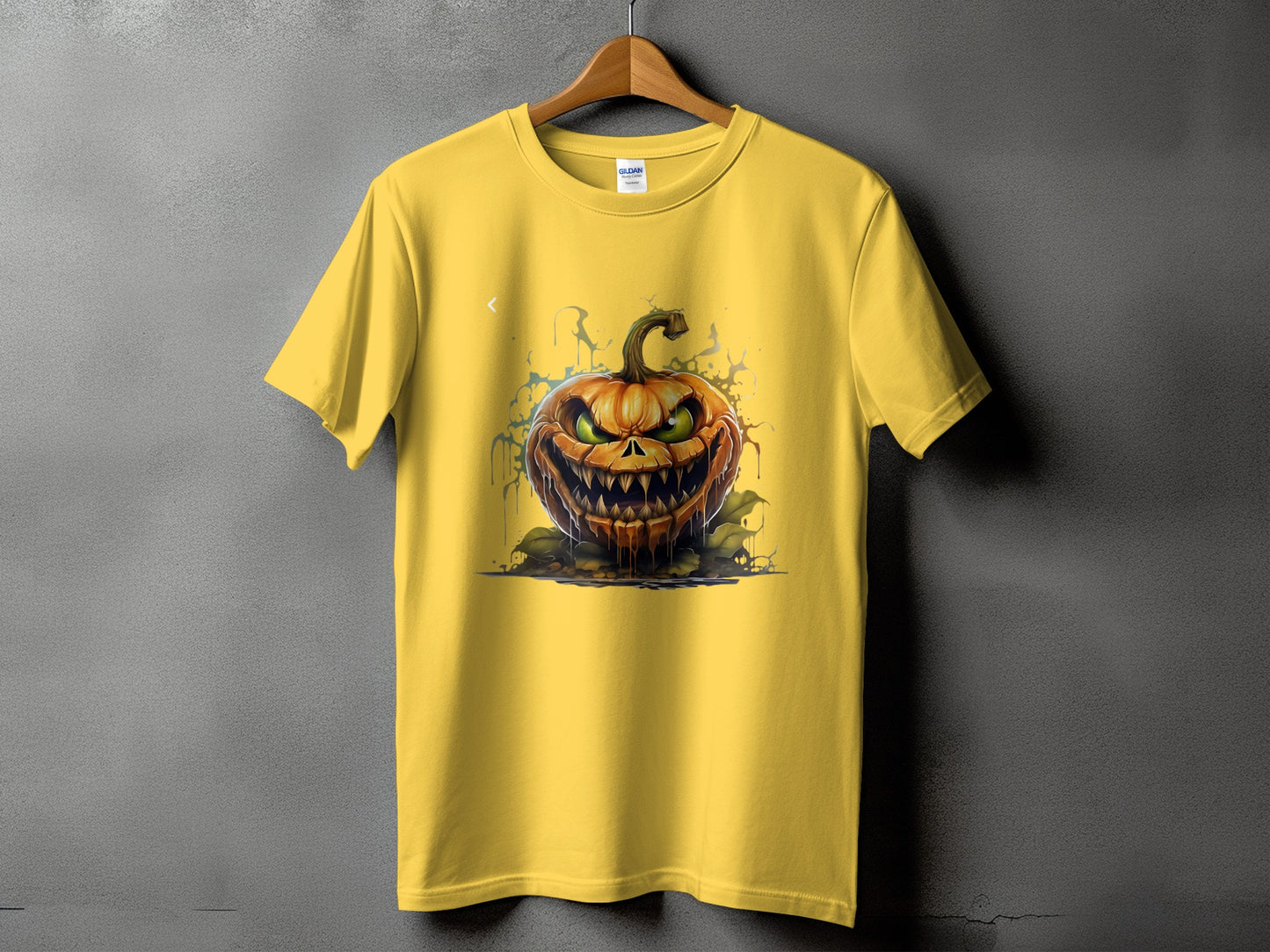 Yellow t-shirt with a scary jack-o'-lantern graphic and dripping paint effect.
