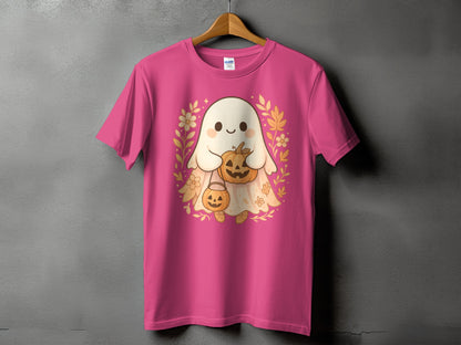 Pink t-shirt with a cute ghost holding pumpkins and surrounded by fall foliage.