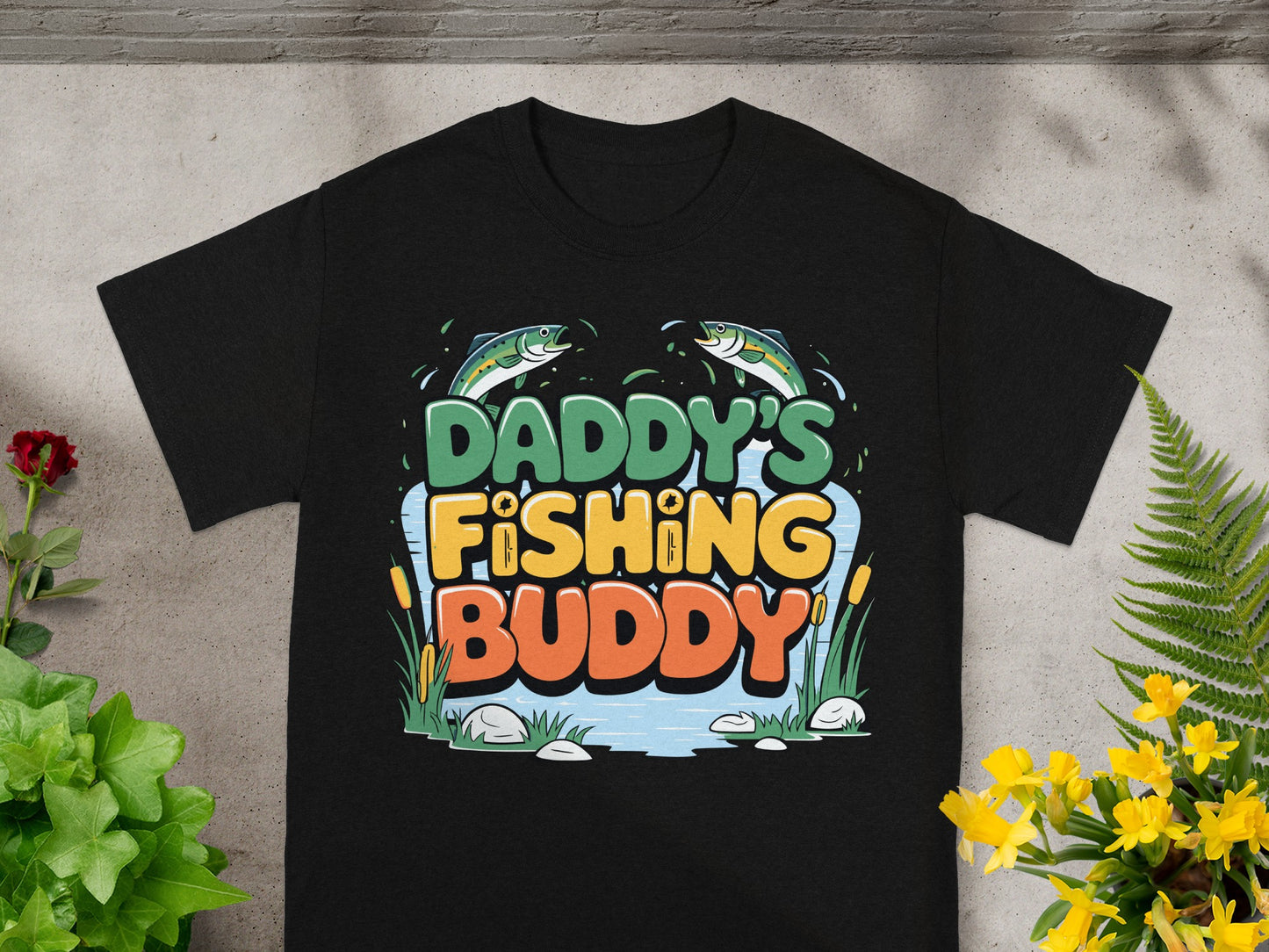 Black t-shirt with "Daddy's Fishing Buddy" graphic and cartoon fish.