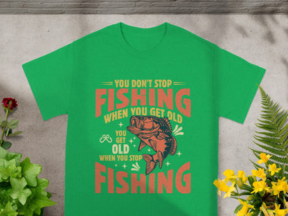 Green t-shirt with "You Don't Stop Fishing When You Get Old" graphic.