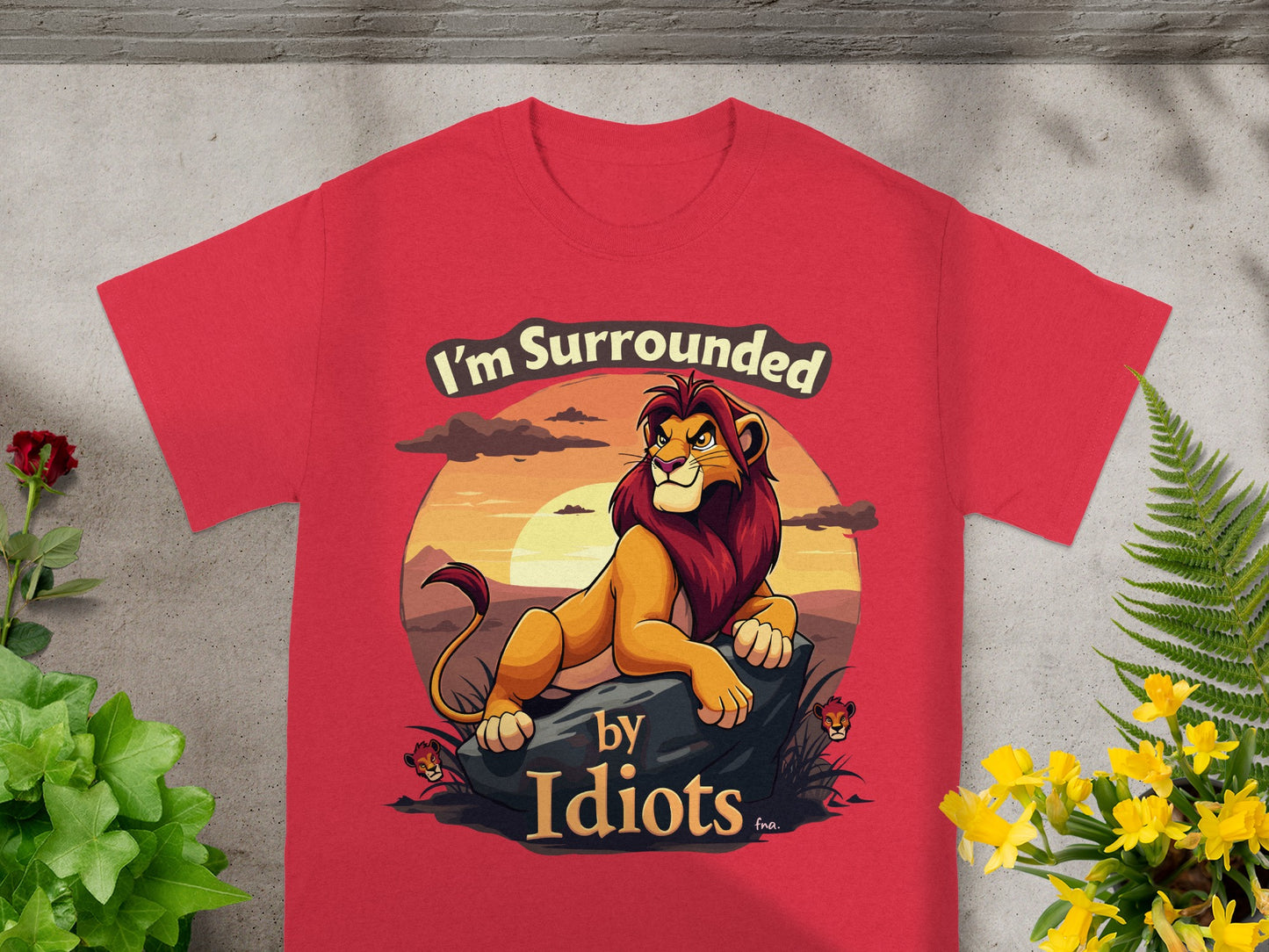 Red t-shirt with a lion and "I'm Surrounded by Idiots" text.