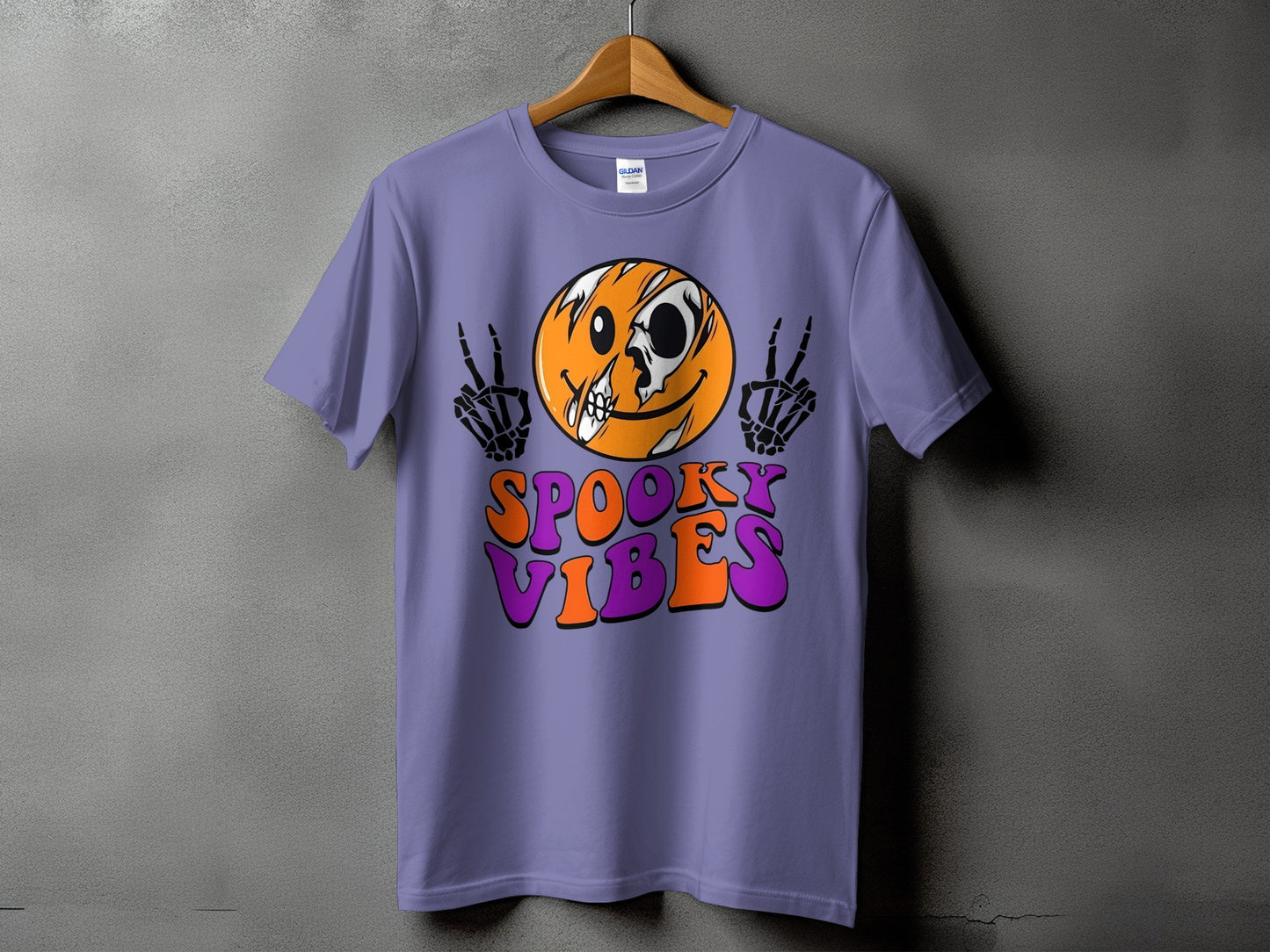 Purple t-shirt with spooky smiley face, skeleton hands, and "Spooky Vibes" text.