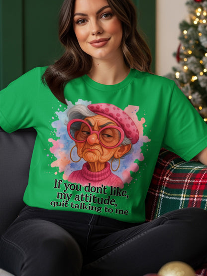 Woman wearing green t-shirt with grumpy old lady graphic and text.