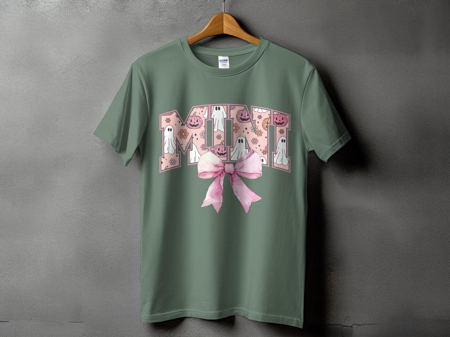 Green t-shirt with "Mimi" text filled with ghosts, pumpkins, and flowers.