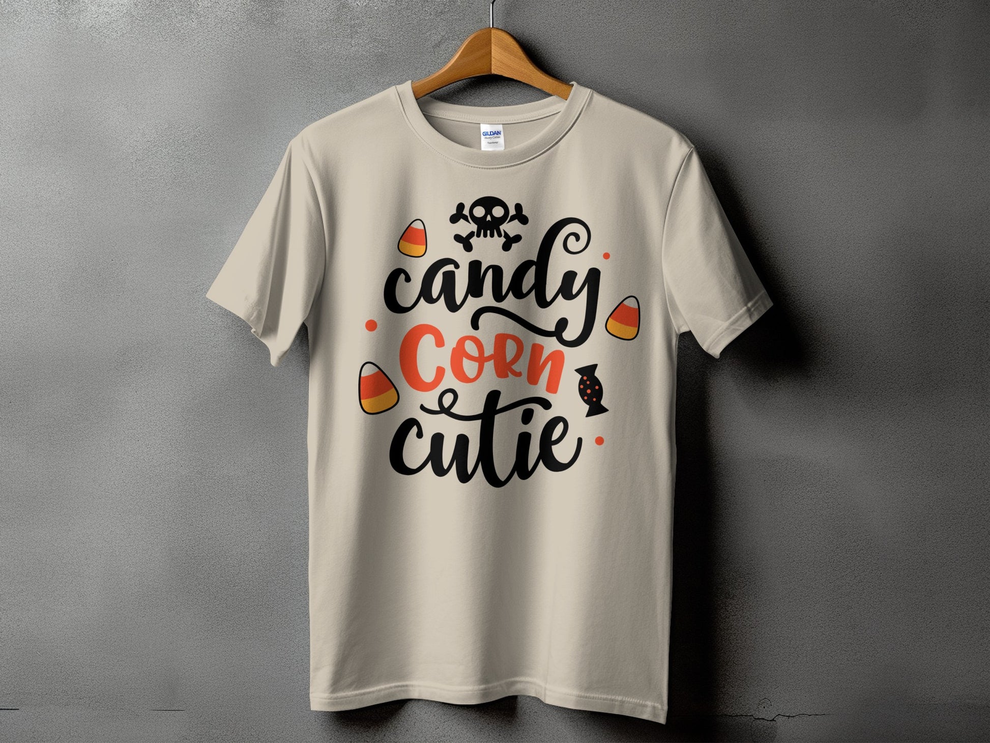 Light beige t-shirt with "candy Corn cutie" text and Halloween graphics.