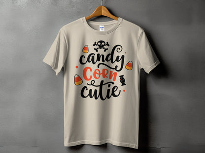 Light beige t-shirt with "candy Corn cutie" text and Halloween graphics.