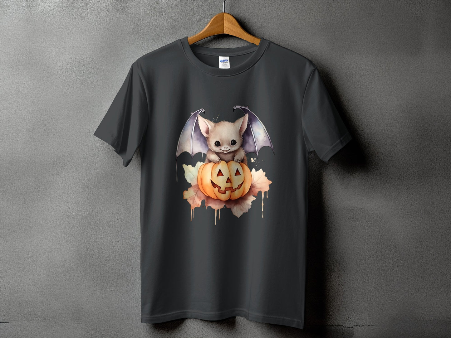 Dark gray t-shirt with a cute bat sitting on a Jack-o'-lantern graphic.