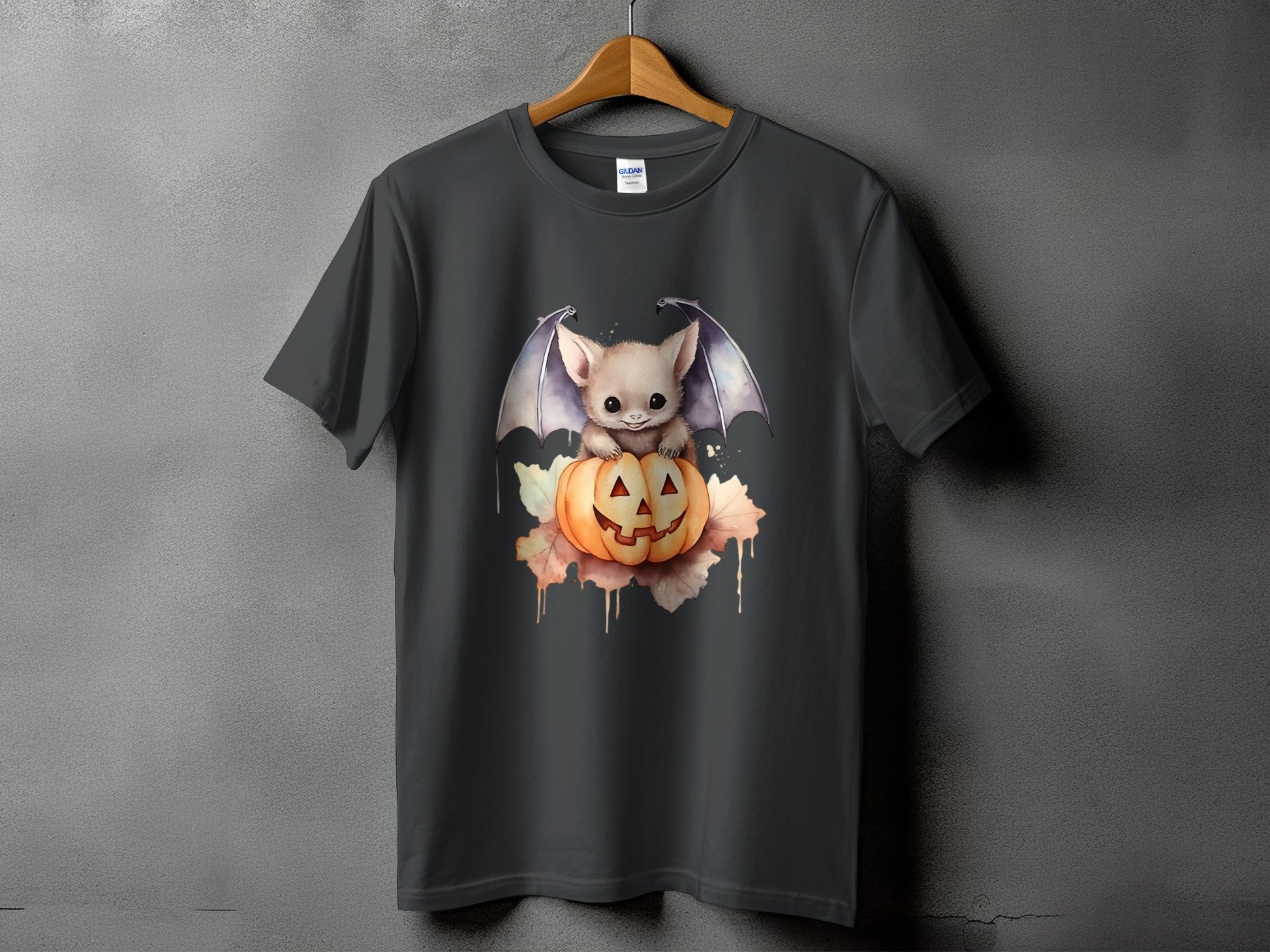 Dark gray t-shirt with a cute bat sitting on a Jack-o'-lantern graphic.
