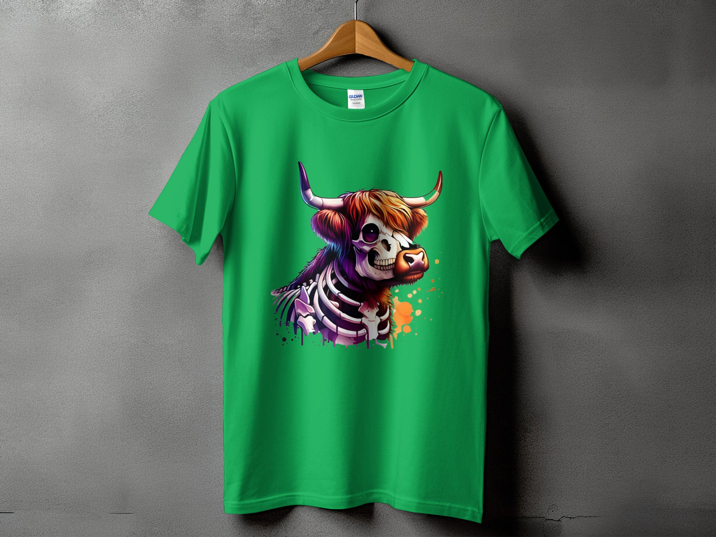 Green t-shirt with a skeleton highland cow graphic and colorful paint splatters.