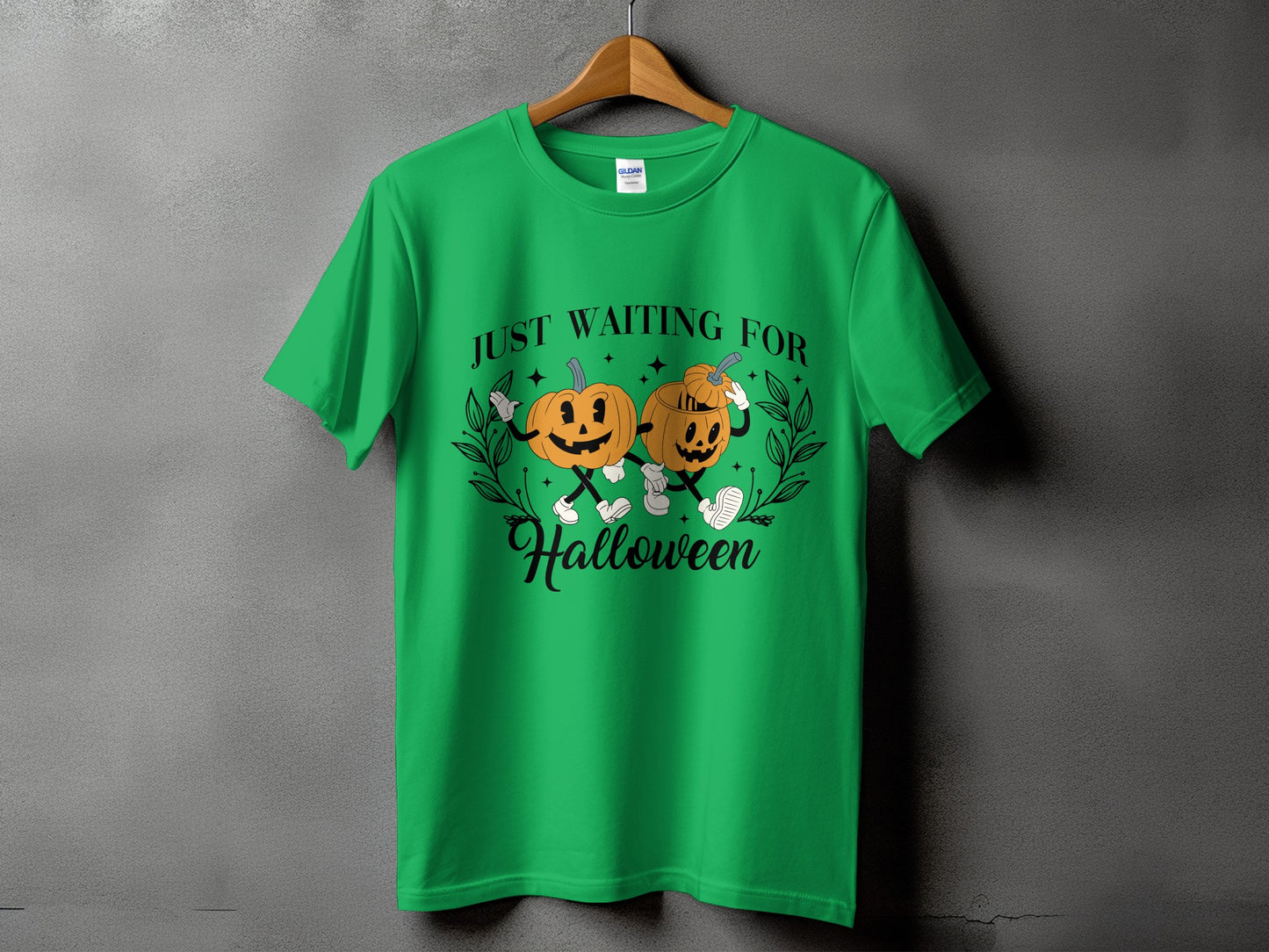 Green t-shirt with pumpkins and the text "Just Waiting For Halloween".