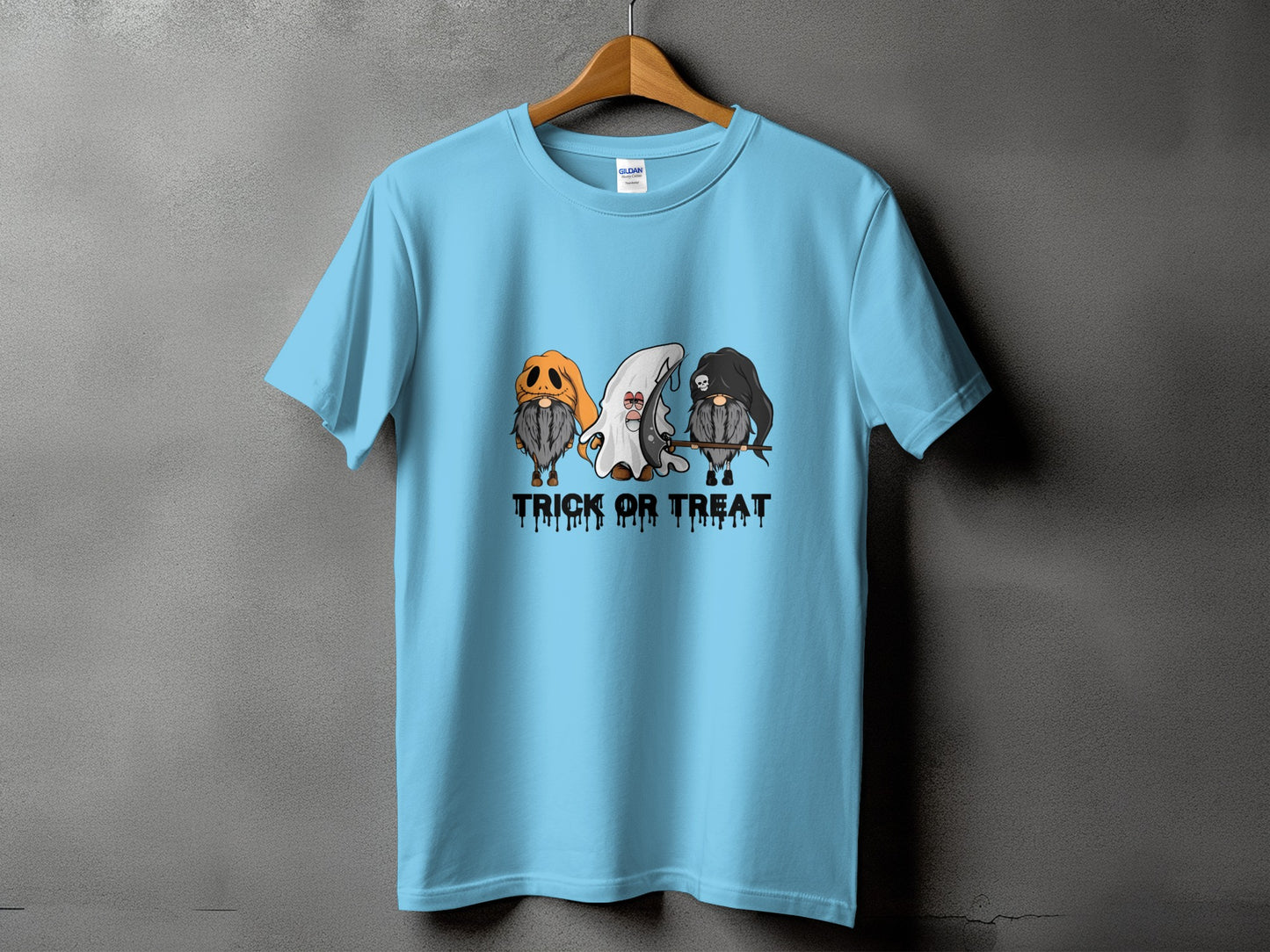 Light blue t-shirt with cartoon gnomes dressed for Halloween and "Trick or Treat" text.