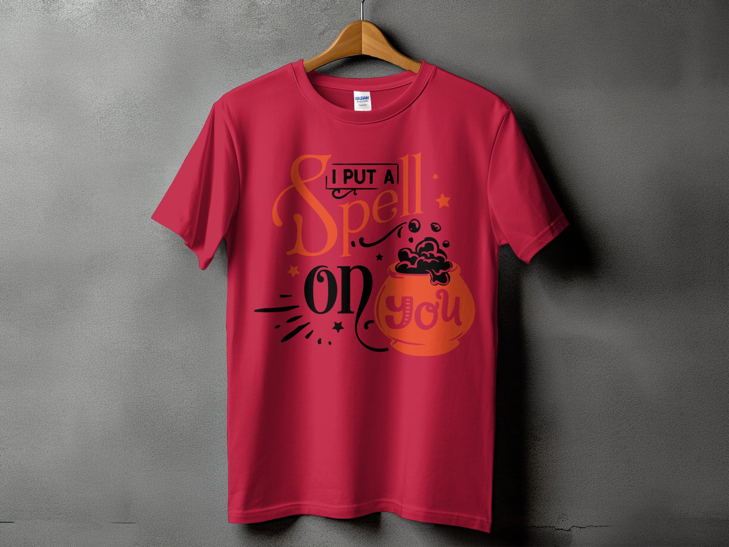 Red t-shirt with text "I PUT A Spell on you" and a cauldron graphic.