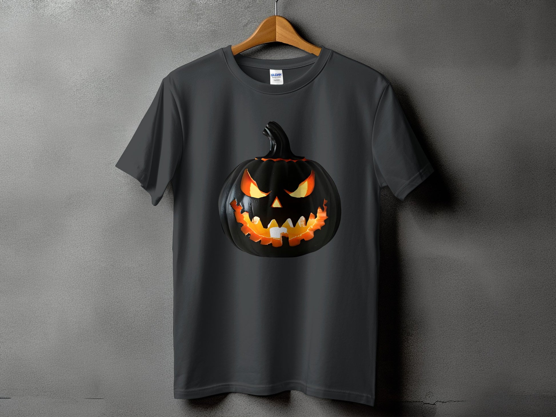 Dark grey t-shirt with a glowing, carved black pumpkin Halloween graphic.