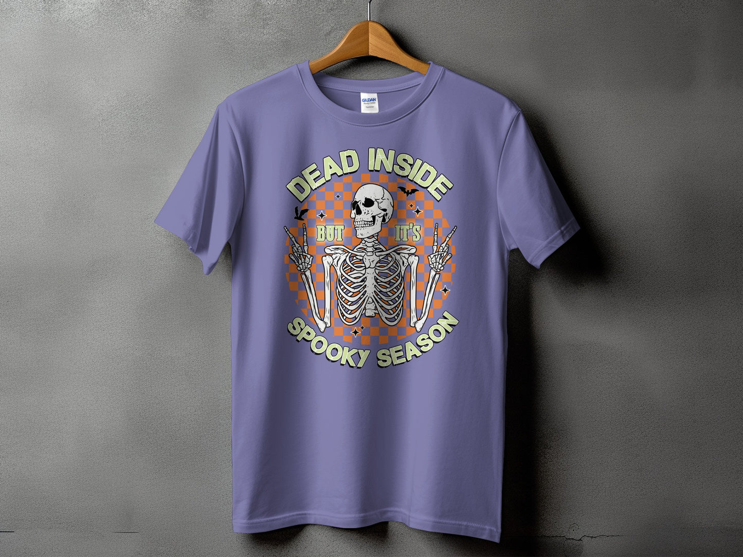Purple t-shirt with skeleton graphic and text "Dead Inside But It's Spooky Season".