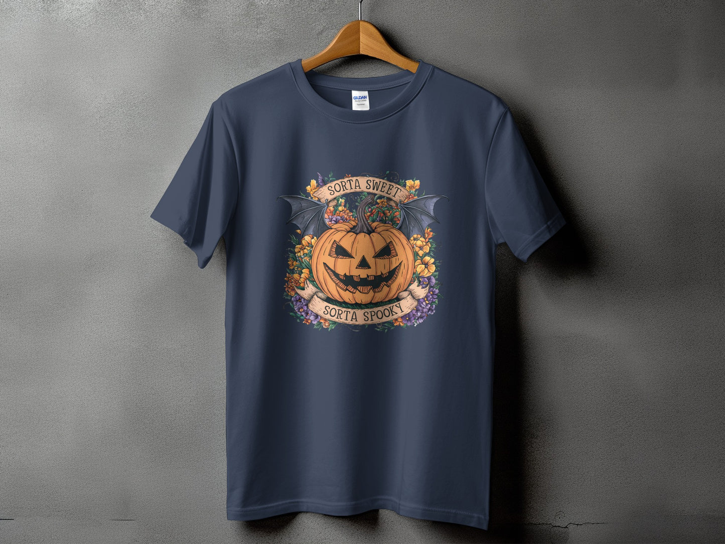 Dark blue t-shirt with jack-o'-lantern, bat wings, and "sorta sweet, sorta spooky" text.