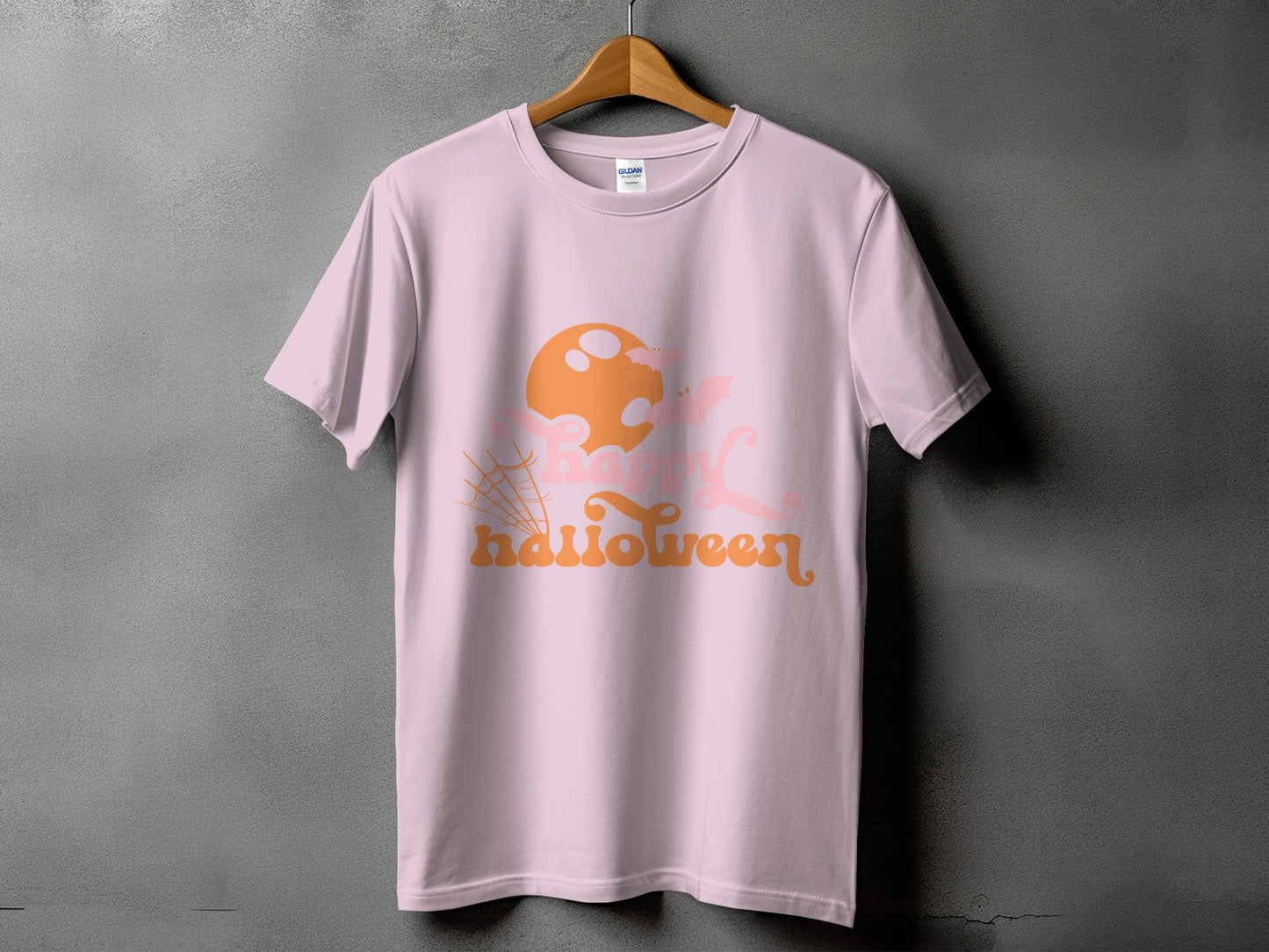Pink t-shirt with orange and pink "Happy Halloween" text and graphic elements.