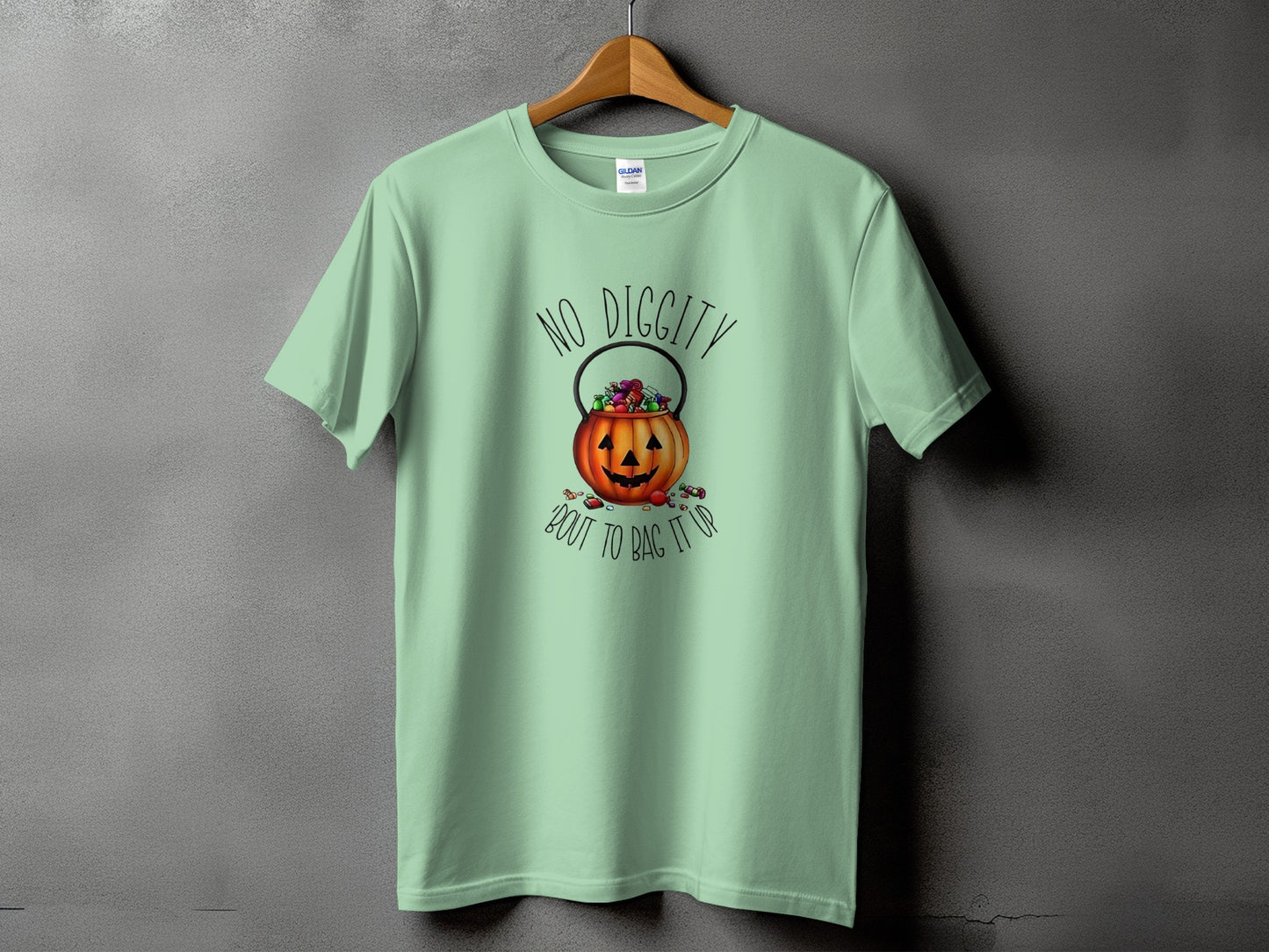 Light green t-shirt with a pumpkin candy bucket and "No Diggity 'Bout to Bag It Up" text.