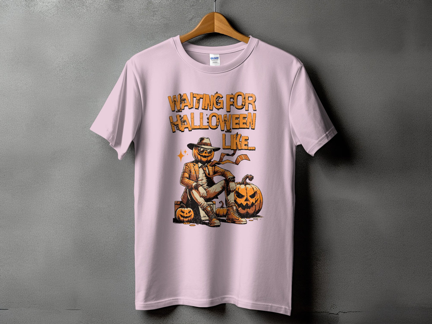 Pink t-shirt with "Waiting for Halloween" graphic of a pumpkin man and pumpkins.
