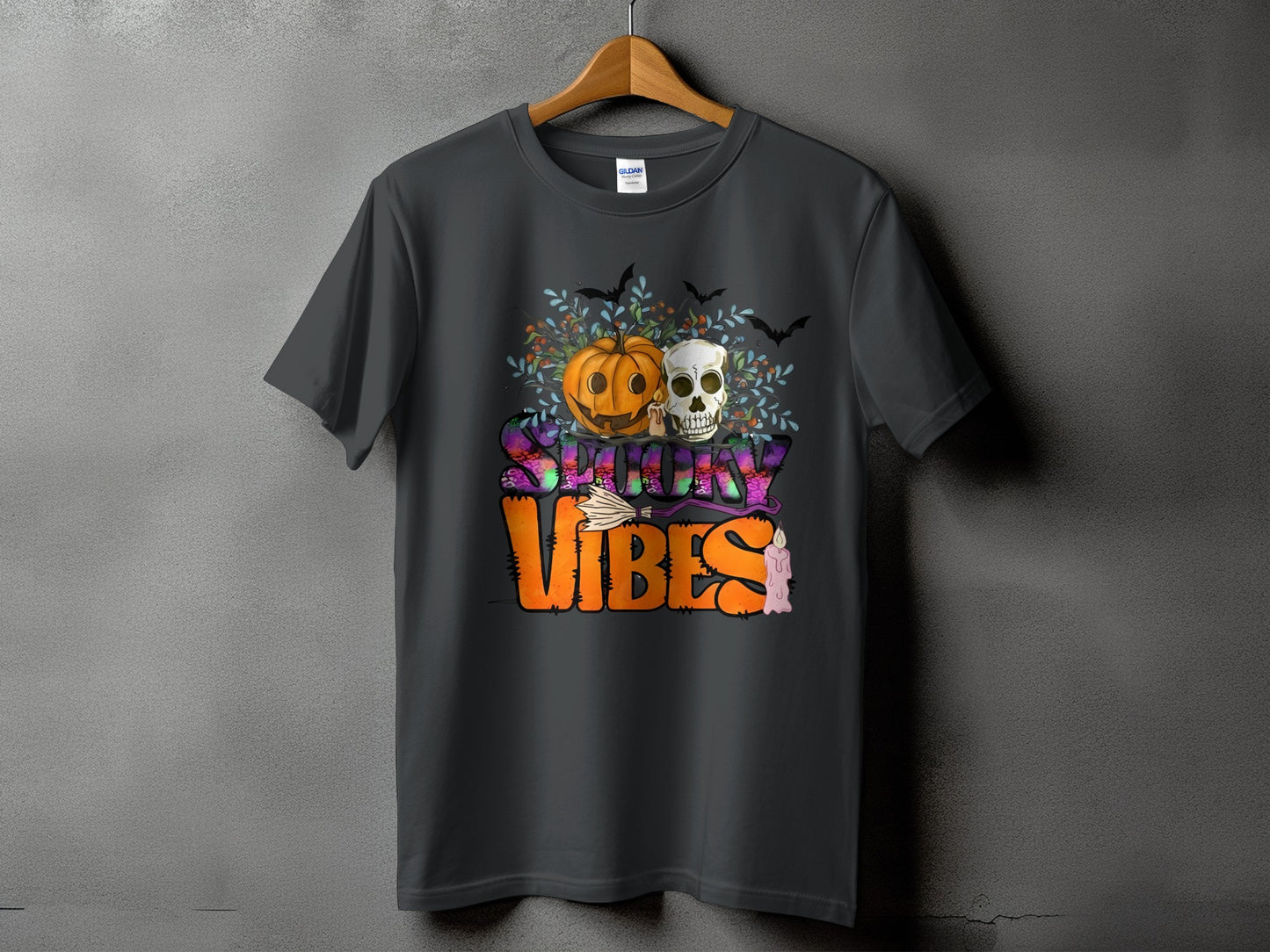 Dark grey t-shirt with "Spooky Vibes" Halloween graphic featuring pumpkin, skull, bats, and candle.