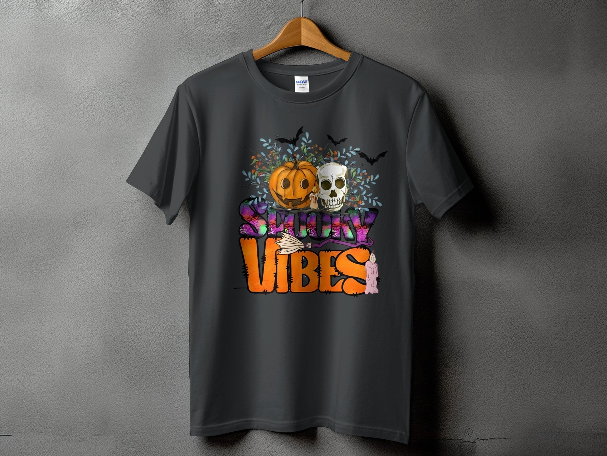 Dark grey t-shirt with "Spooky Vibes" Halloween graphic featuring pumpkin, skull, bats, and candle.