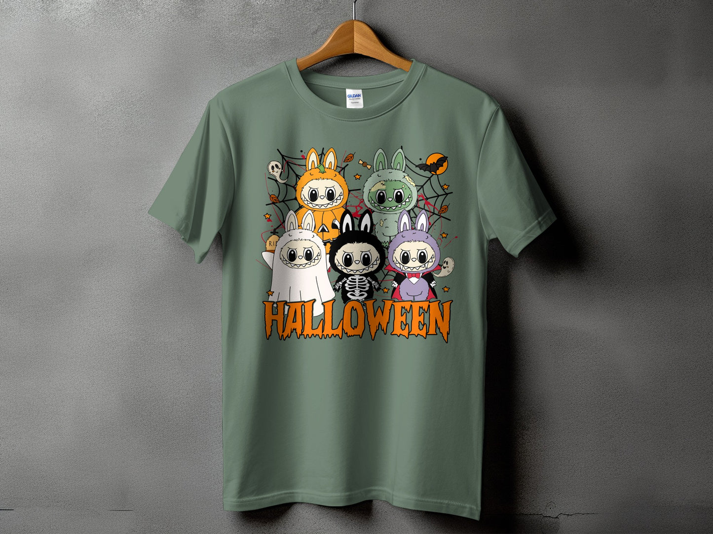 Green t-shirt with Halloween-themed cute characters and text.