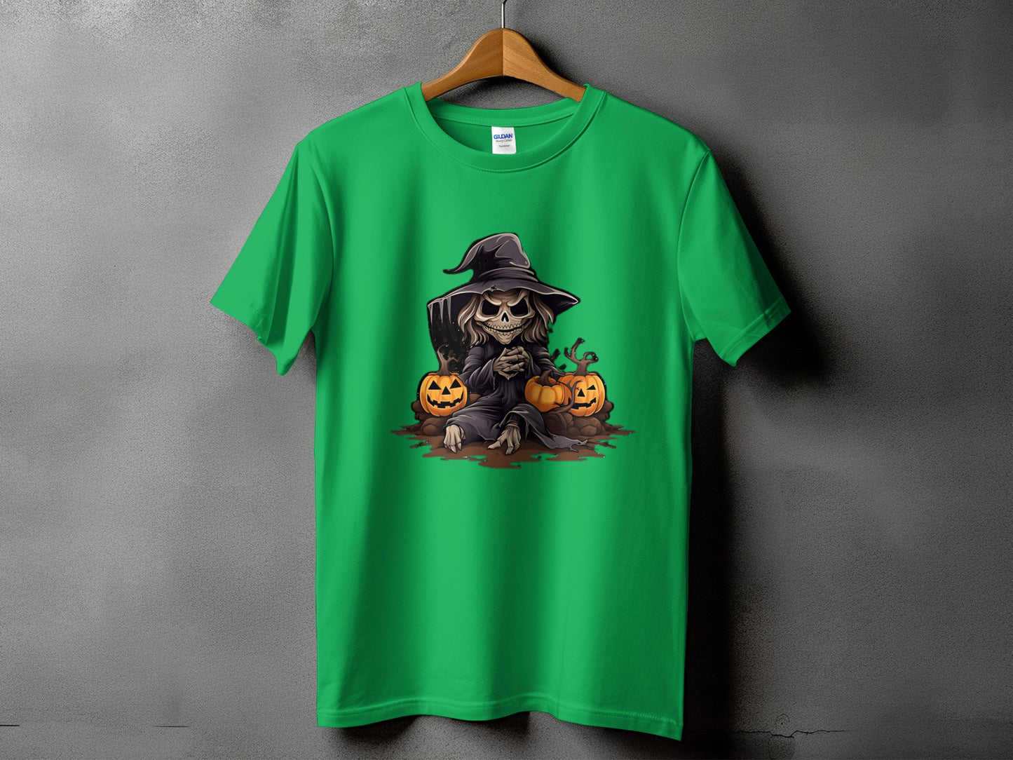 Green t-shirt with grim reaper character sitting between two pumpkins.