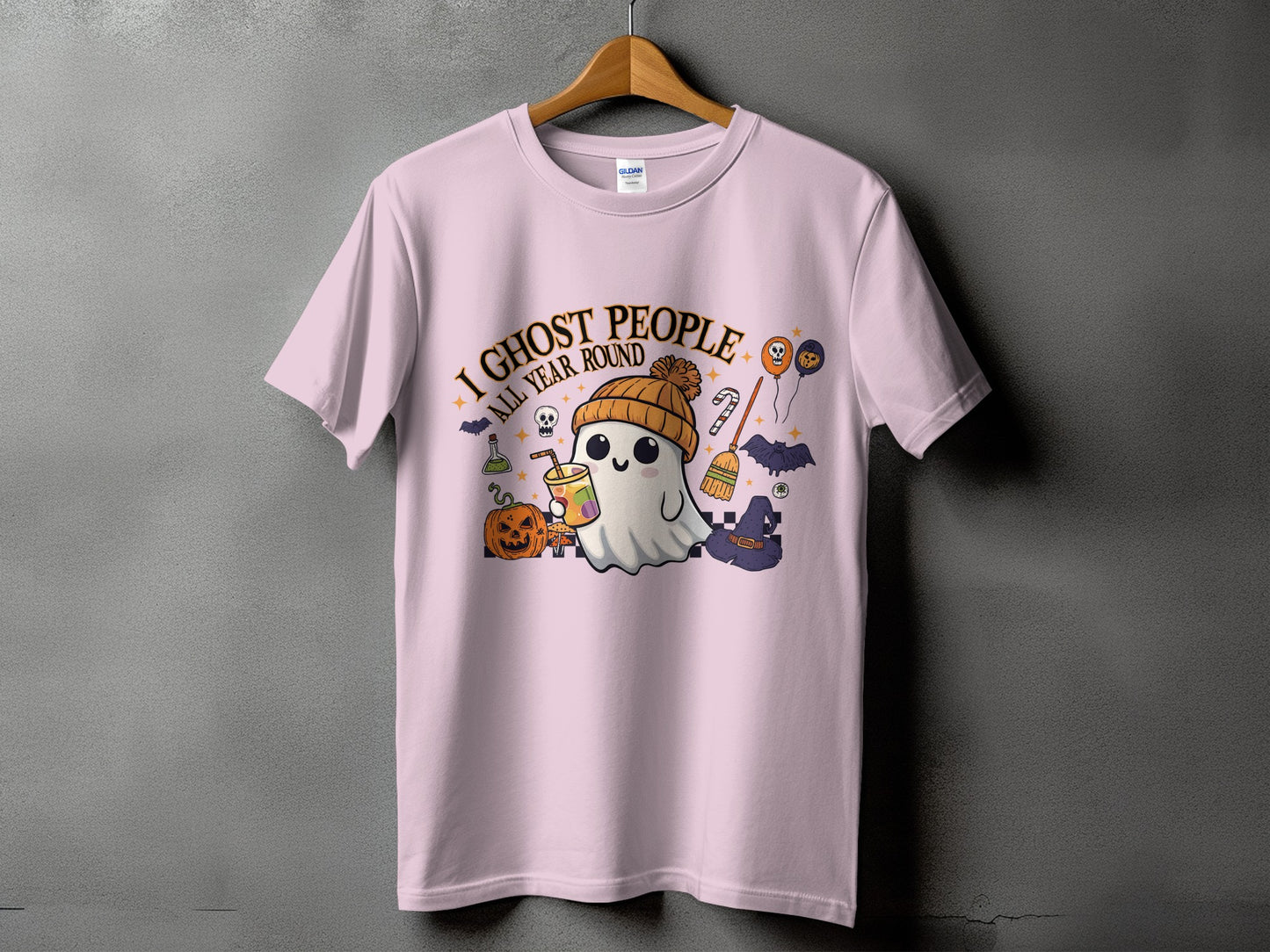 Pink t-shirt with "I Ghost People All Year Round" text and Halloween ghost graphics.